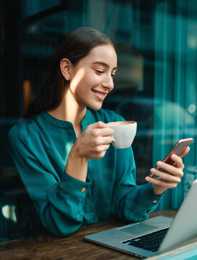 women with coffee and phone