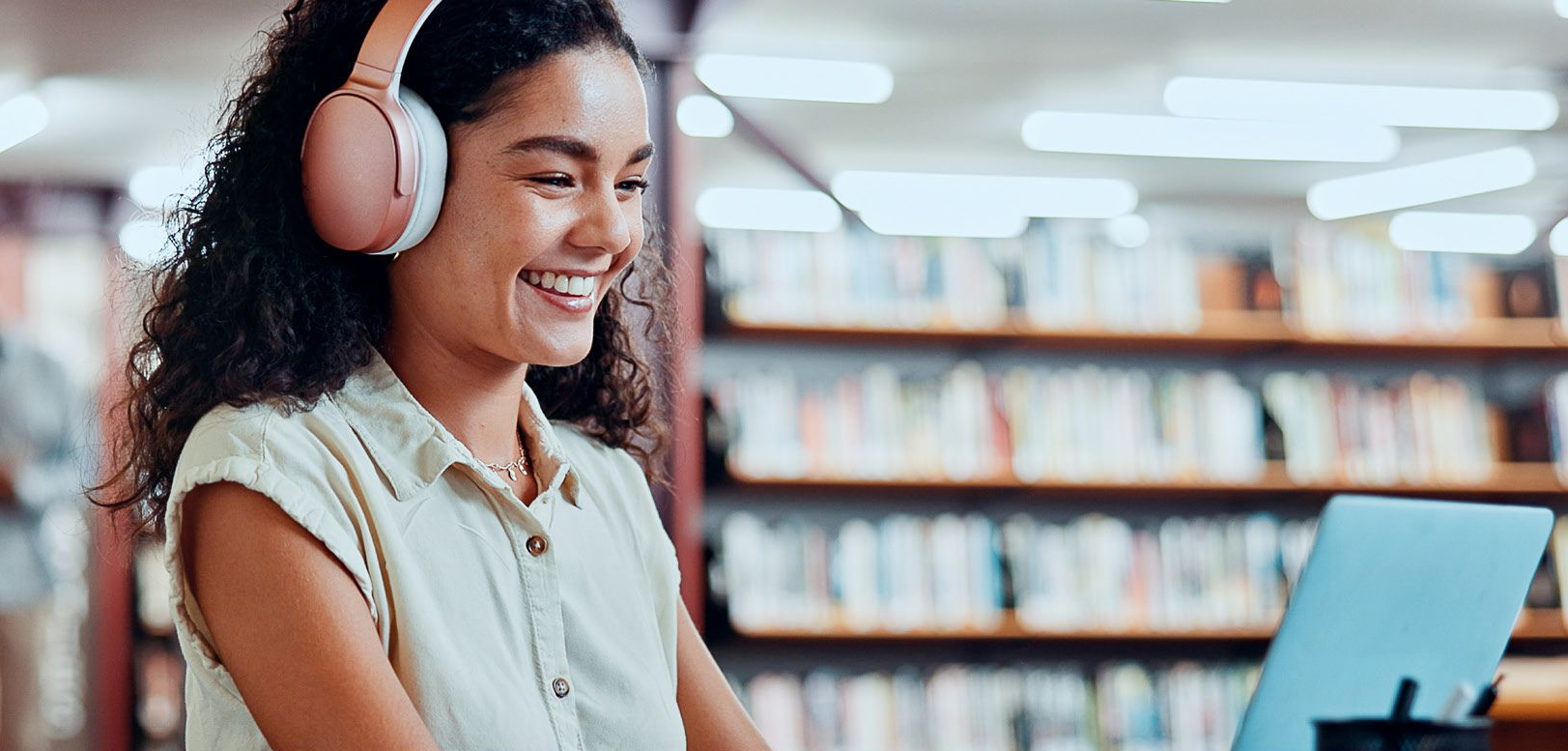 lady in library on laptop