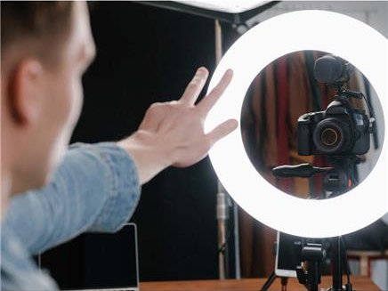 guy with ringlight and camera