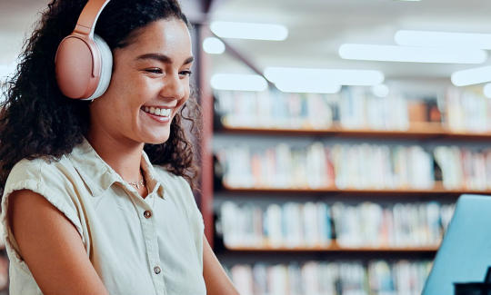 lady in library on laptop